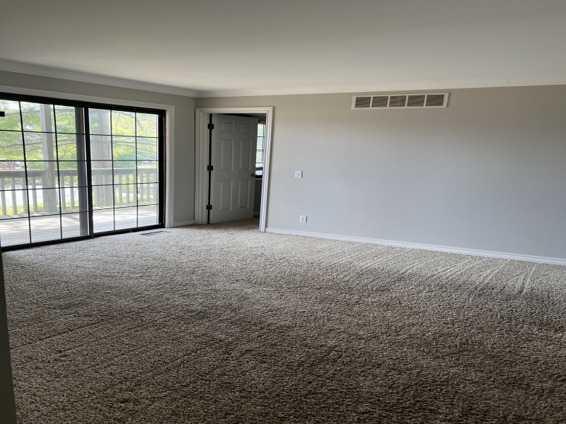 view of living room to outside patio/deck