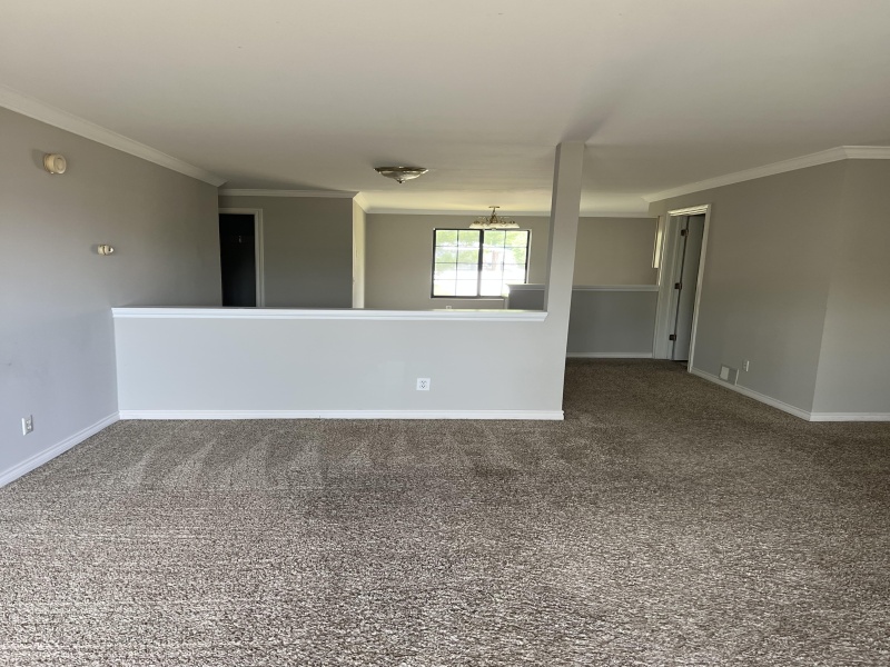 view from living room into dining room and kitchen